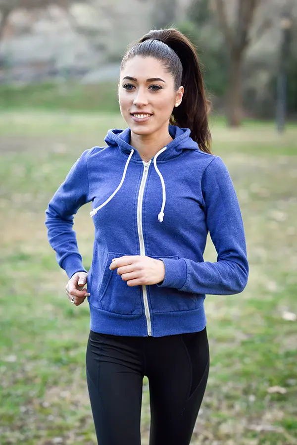 jogging woman in purple hoodie